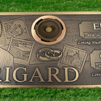 A grave marker that has a picture of a couple, their names, and says Trigard across the bottom